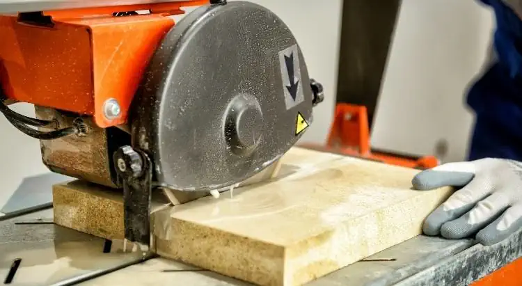 a powerful saw cutting thick slab